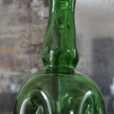 Dented green bottle