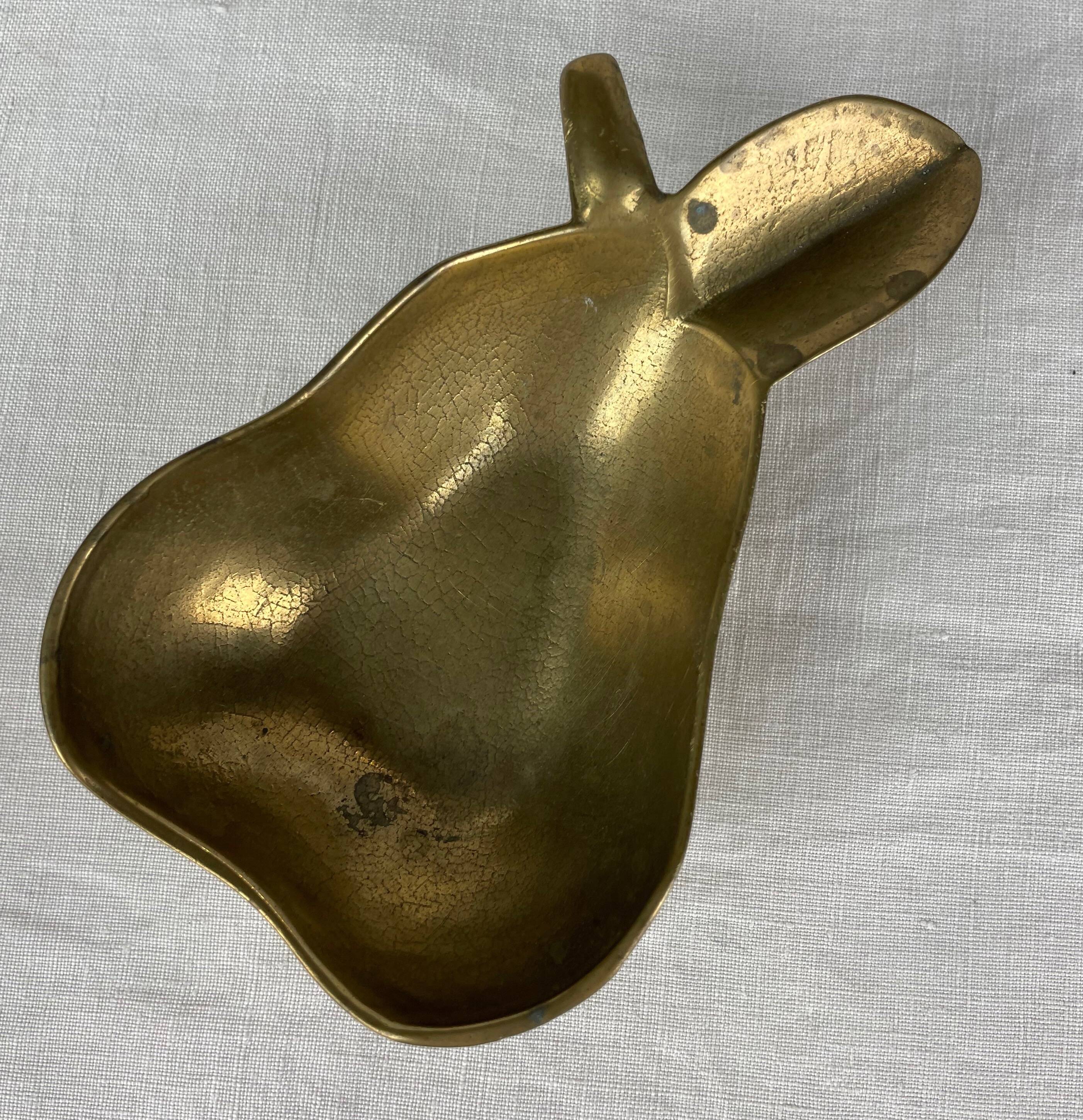 Empty pocket ashtray in pear-shaped brass