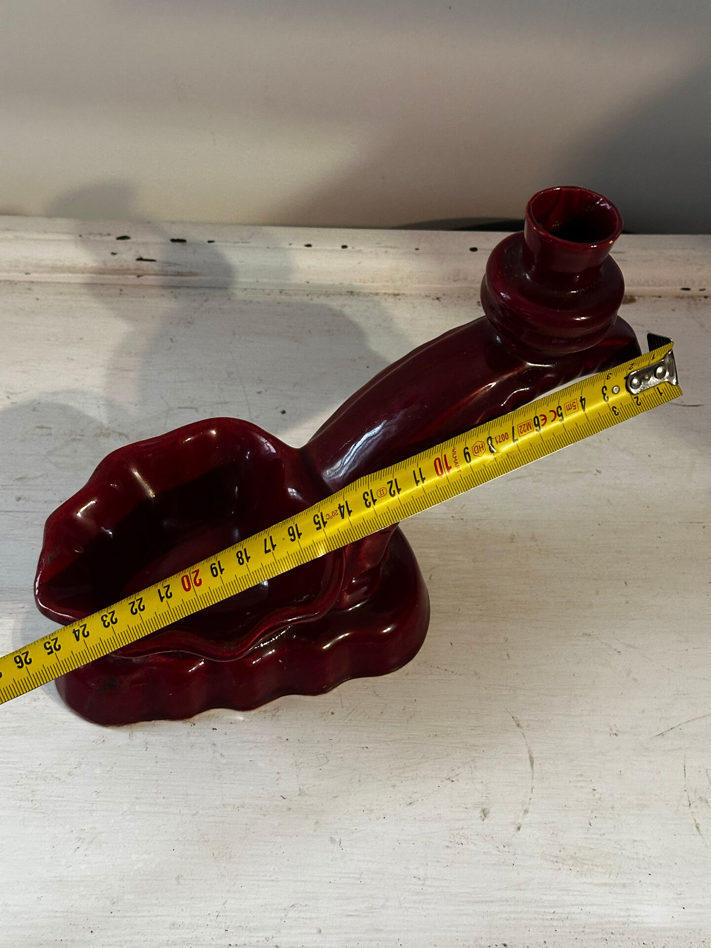 Ruby red ceramic pocket ashtray from Vallauris, numbered.