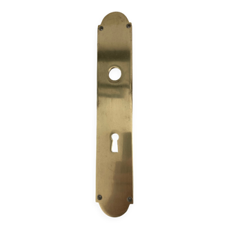 Brass door handle plate with lock entry.