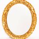 Vintage oval decorative mirror in gilded wood with floral frame, Italy, 1960s.