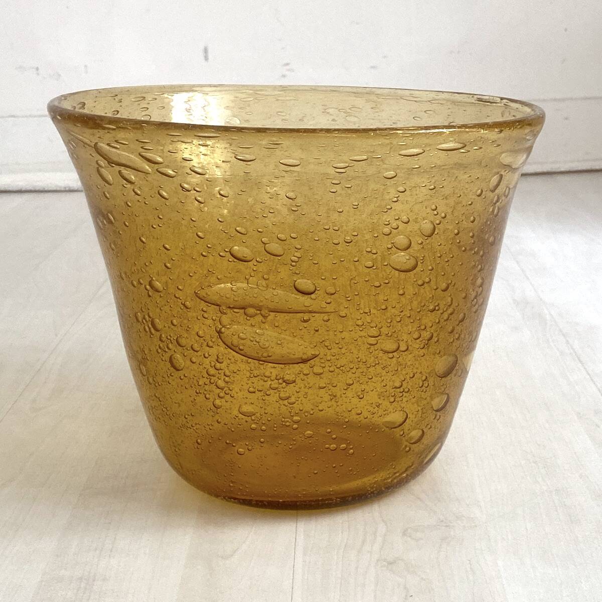 Champagne bucket from the Biot glassworks in ochre-colored blown glass