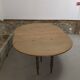 Half-moon extendable oak table for 2 to 8 people.