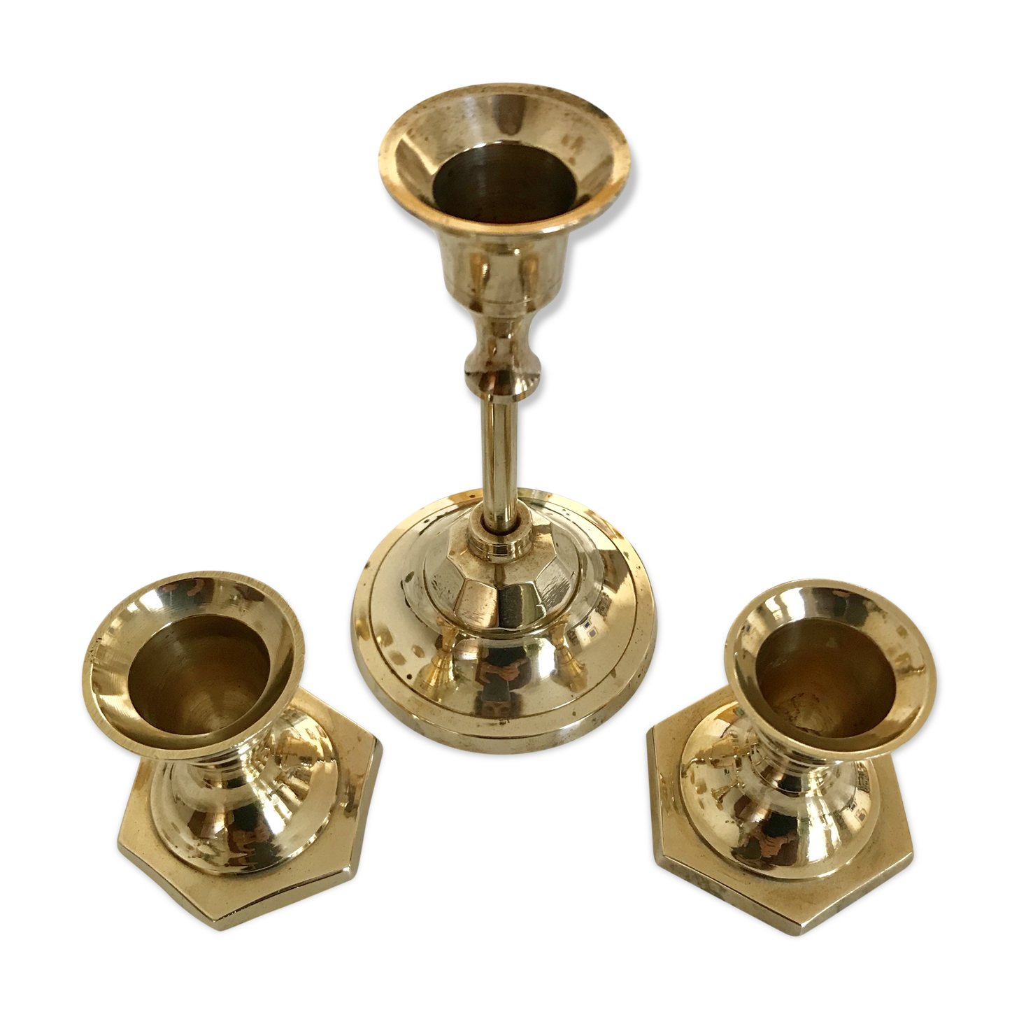 Set of three candlesticks in brass