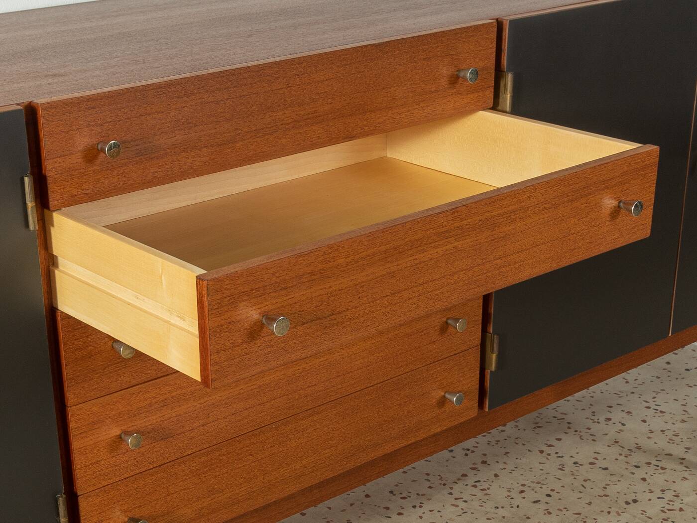 Classic sideboard from the 1960s, teak veneer, black doors, Bauhaus stainless steel feet