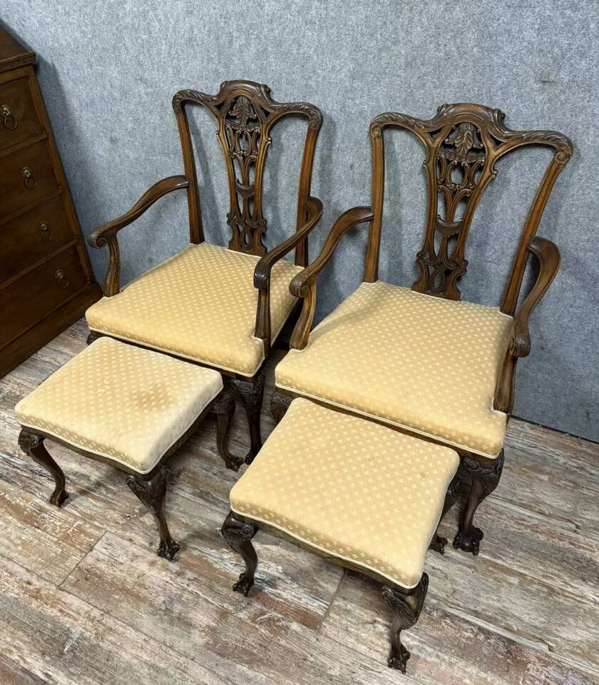 Pair of English armchairs with mahogany footrests circa 1850