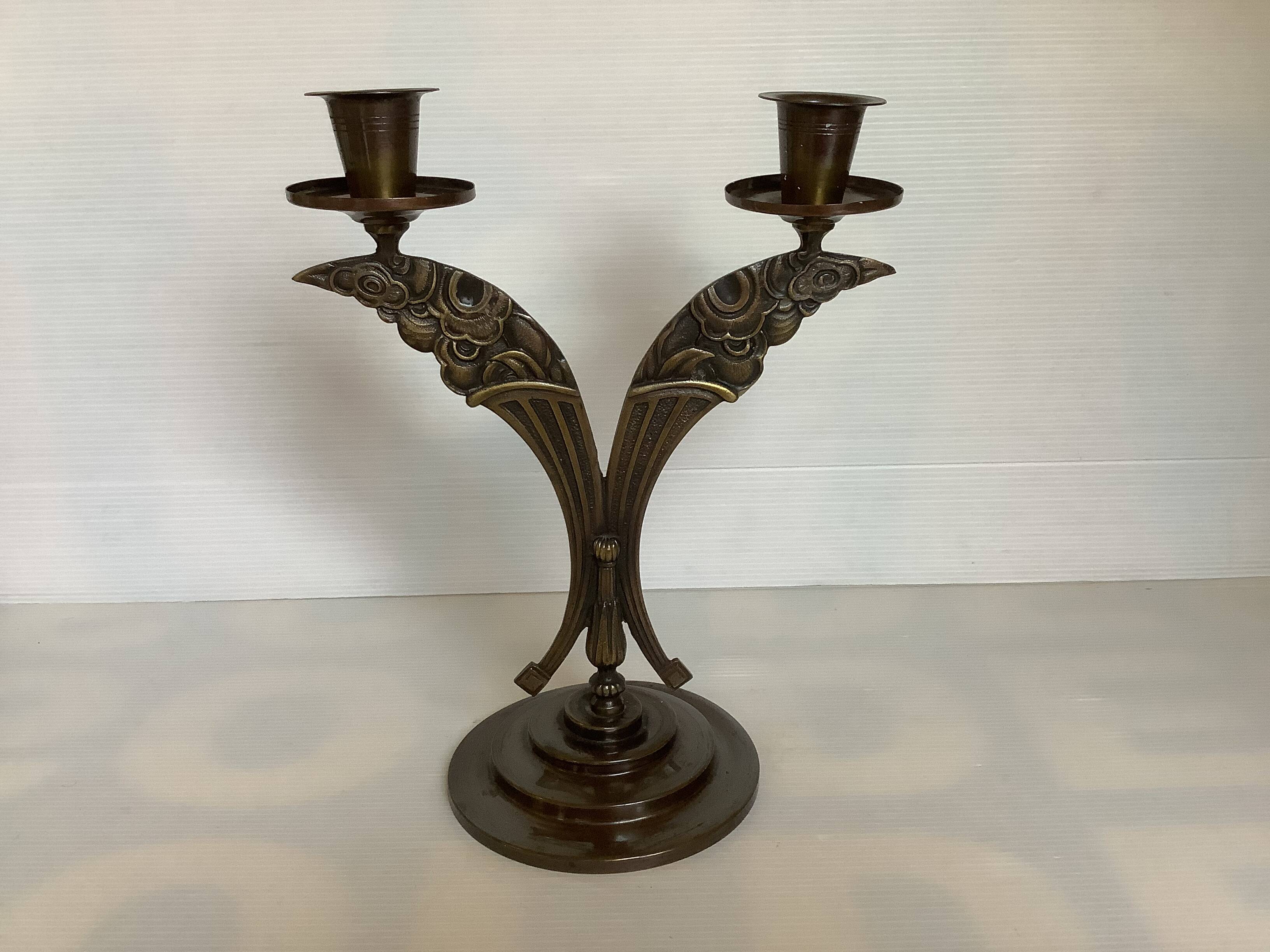 Candle holders in the shape of art deco butterfly wings