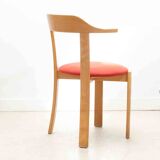 Chair upholstered in red and beech