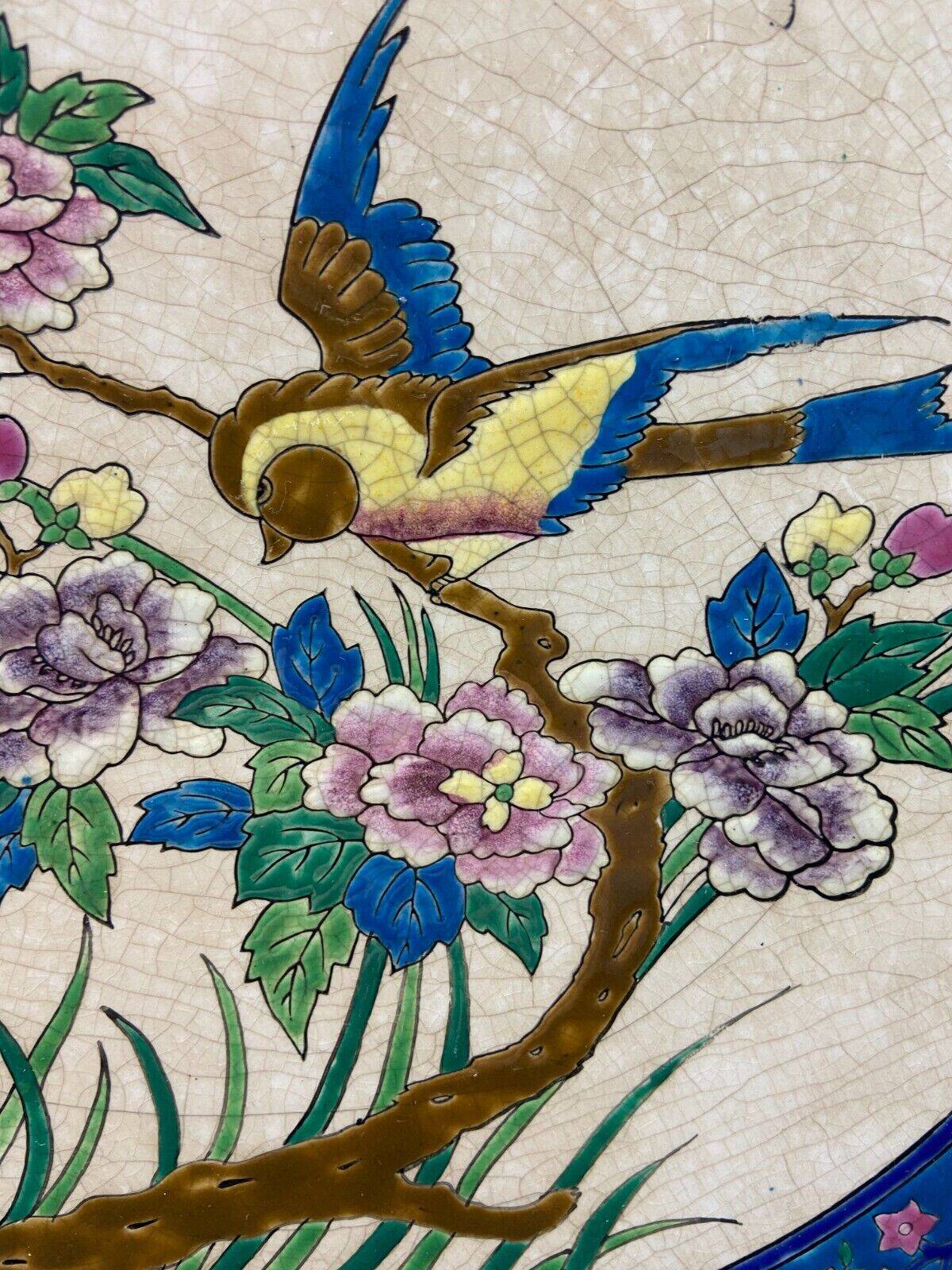 Large circular earthenware dish from Louvière with Longwy style bird decoration