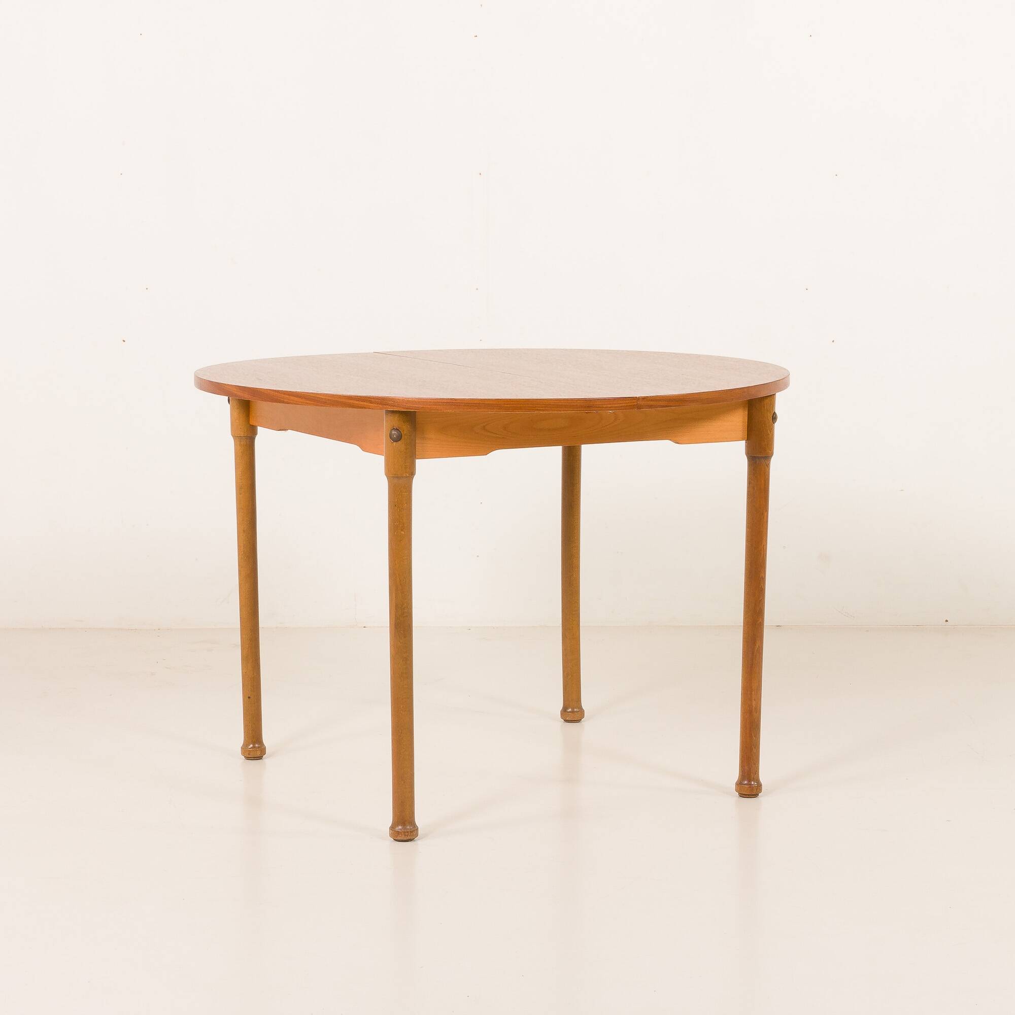 Teak round table with hidden extension, 1970s