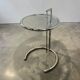 Vintage adjustable chrome side table with smoked glass.