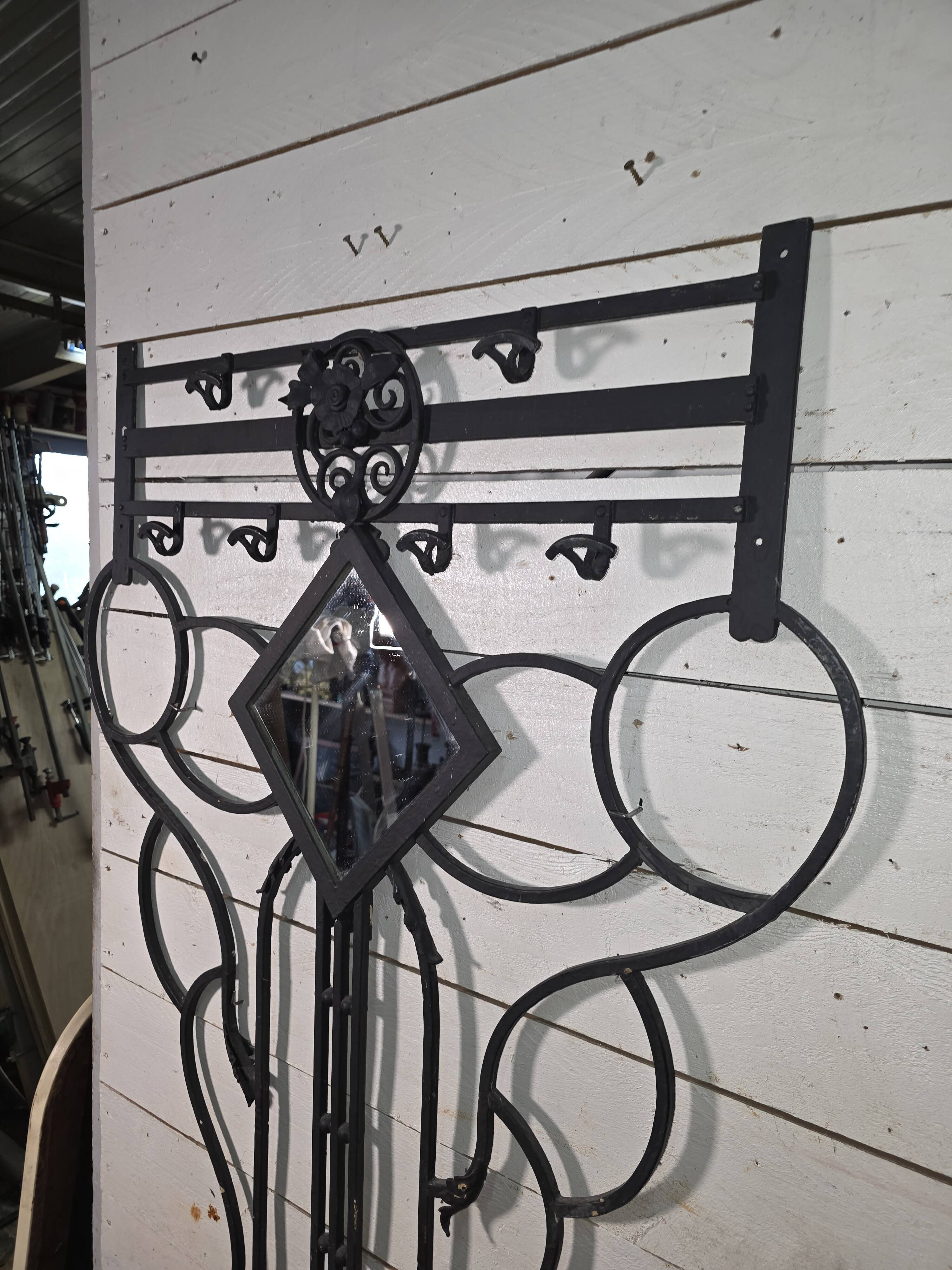 Art Deco coat rack wardrobe in wrought iron from the 1930s.