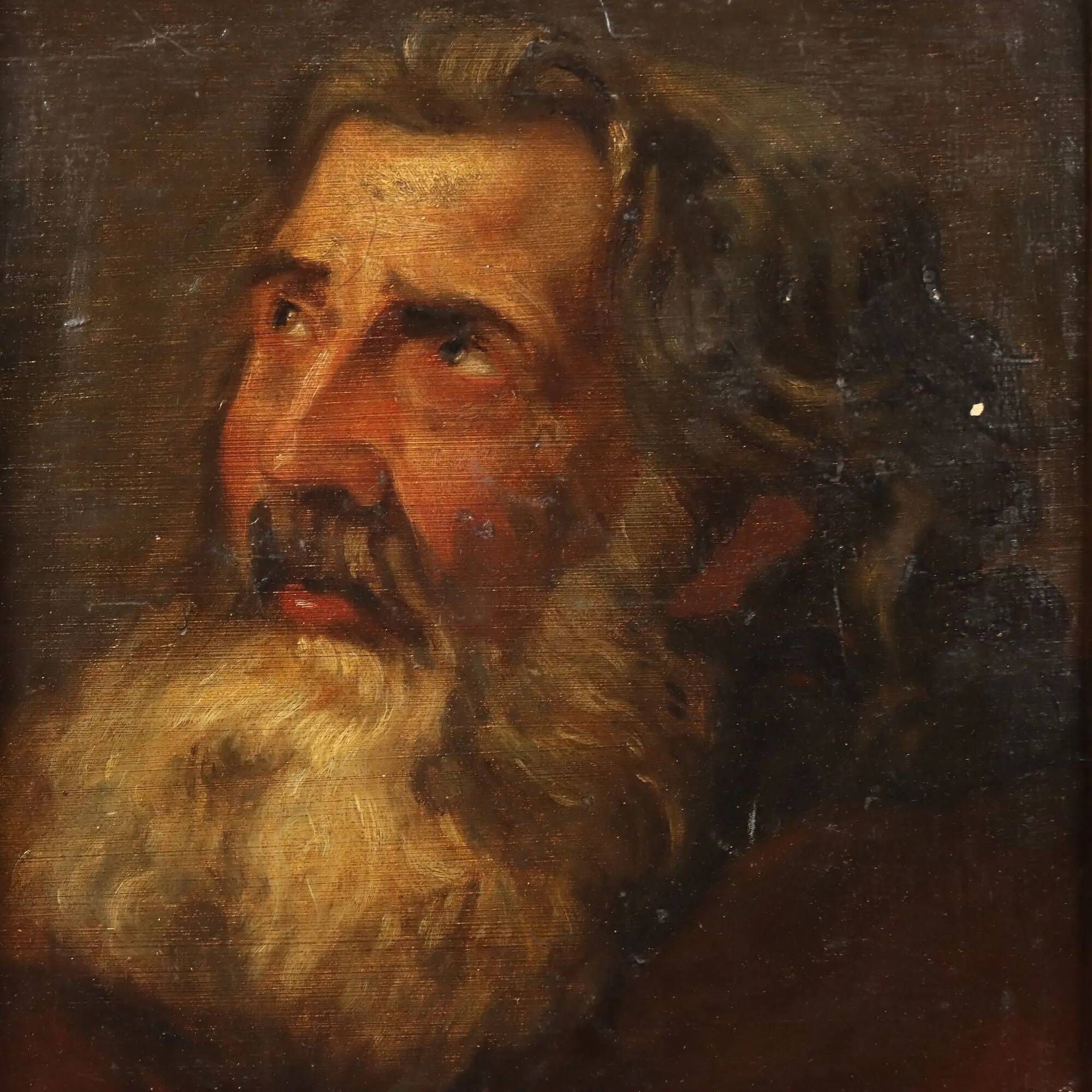 Old painting of a male face in oil on cardboard from the 19th century.