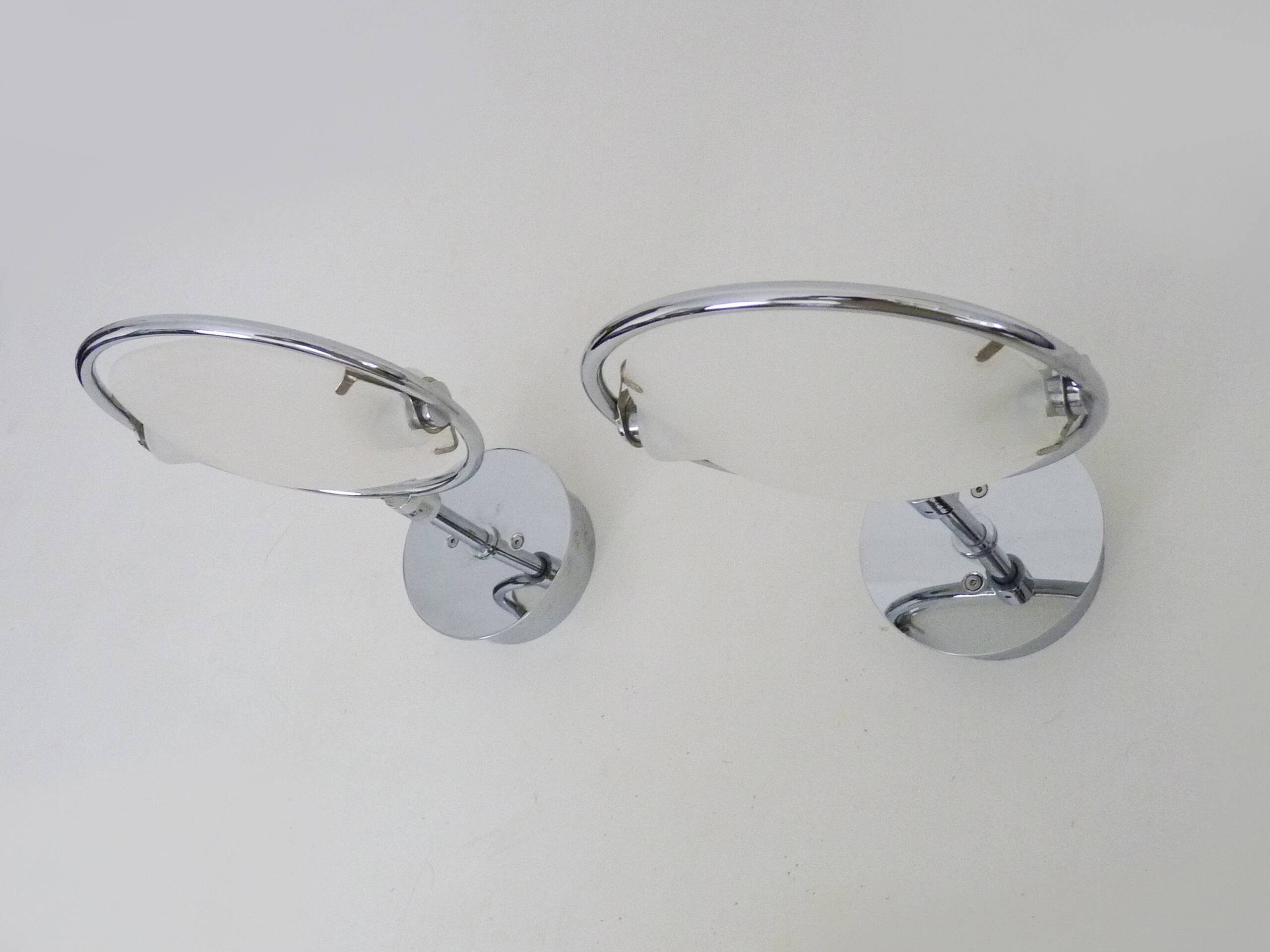 Pair of Italian Fontana Arte Nobi wall lights in chrome metal and satin glass.