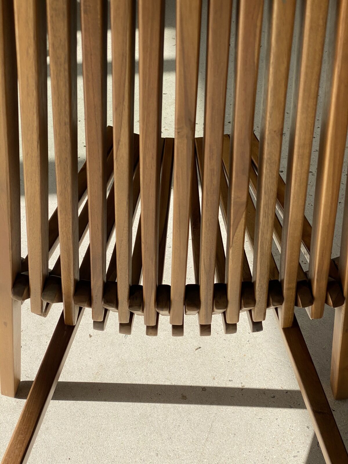 Foldable designer armchair in wooden slats