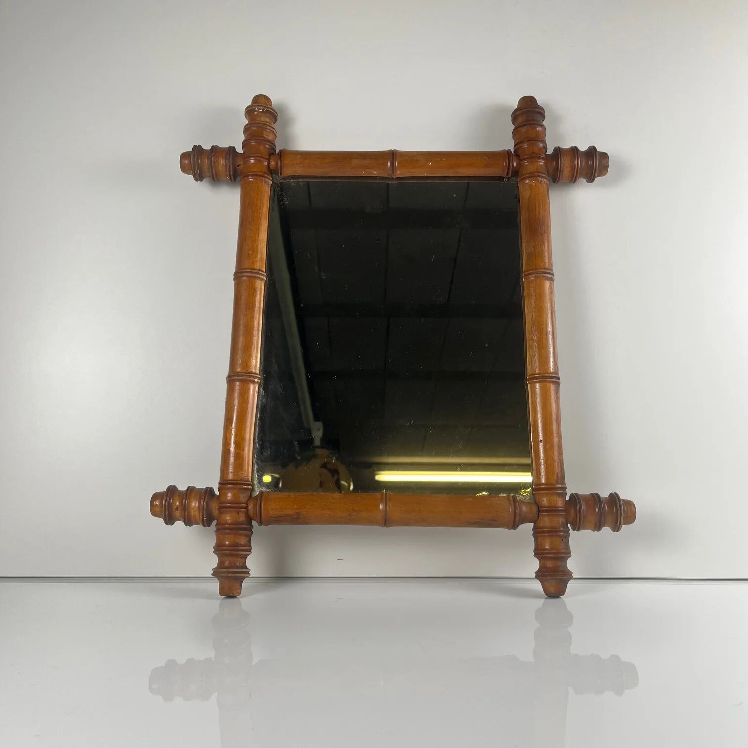 Wooden turned mirror in bamboo style, circa 1900-1930.