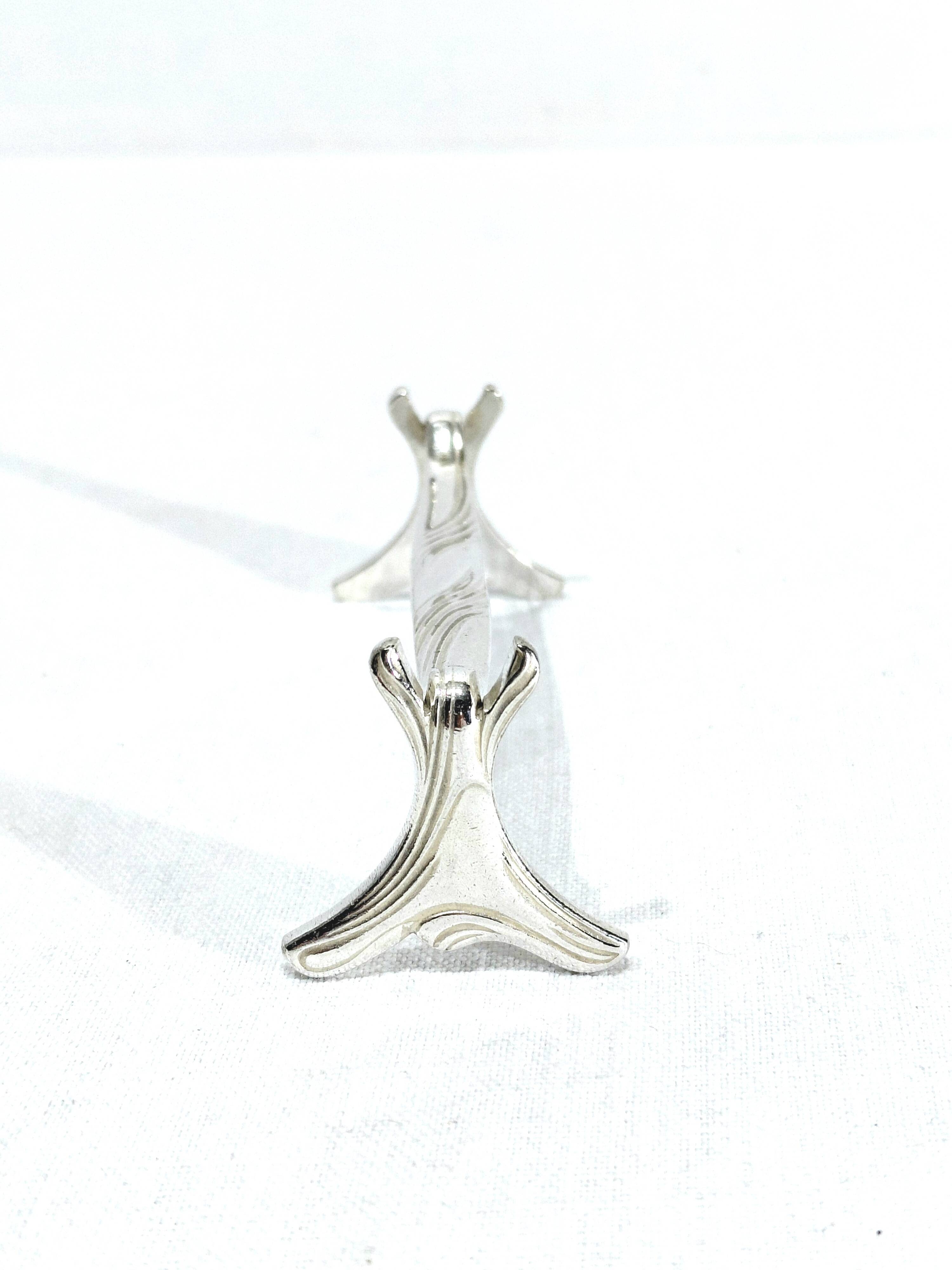 CHRISTOFLE - SET OF 11 SILVER-PLATED KNIFE RESTS