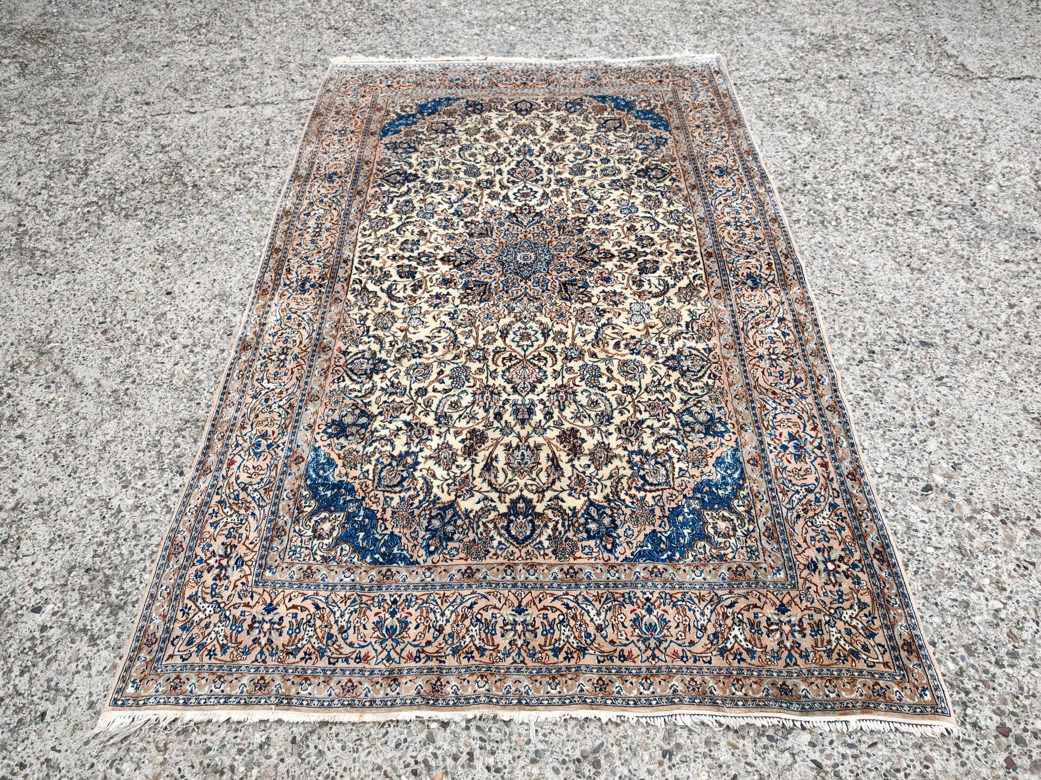 Vintage Persian Nain carpet, handwoven wool and silk from the 1940s.