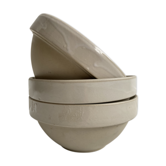 Trio of beige enamelled sandstone bowls