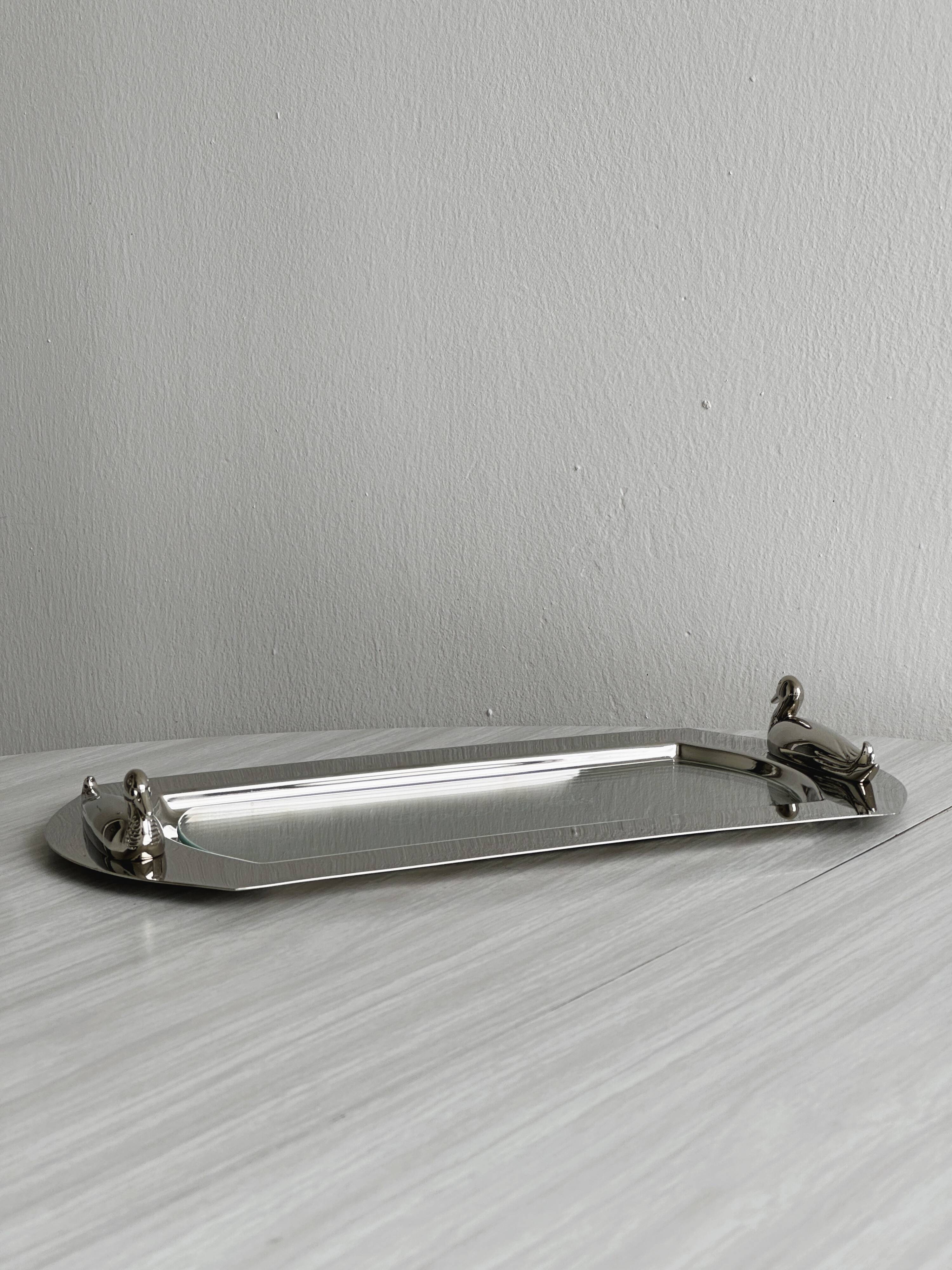 Shiny metal foie gras dish