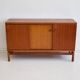 Modern mid-century teak sideboard with brass details.