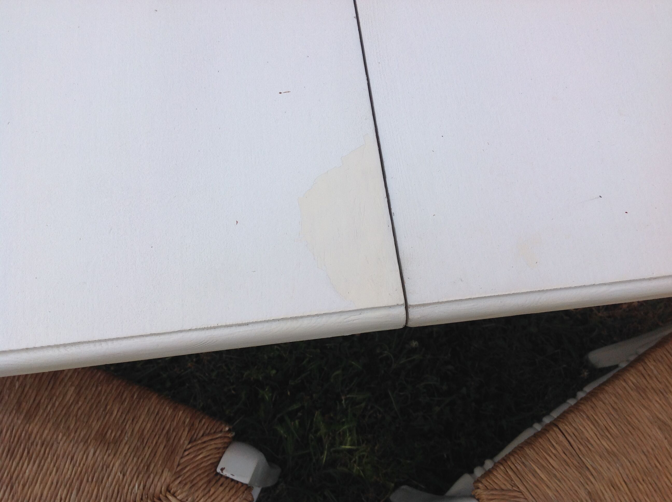 White farmhouse table set and four chairs