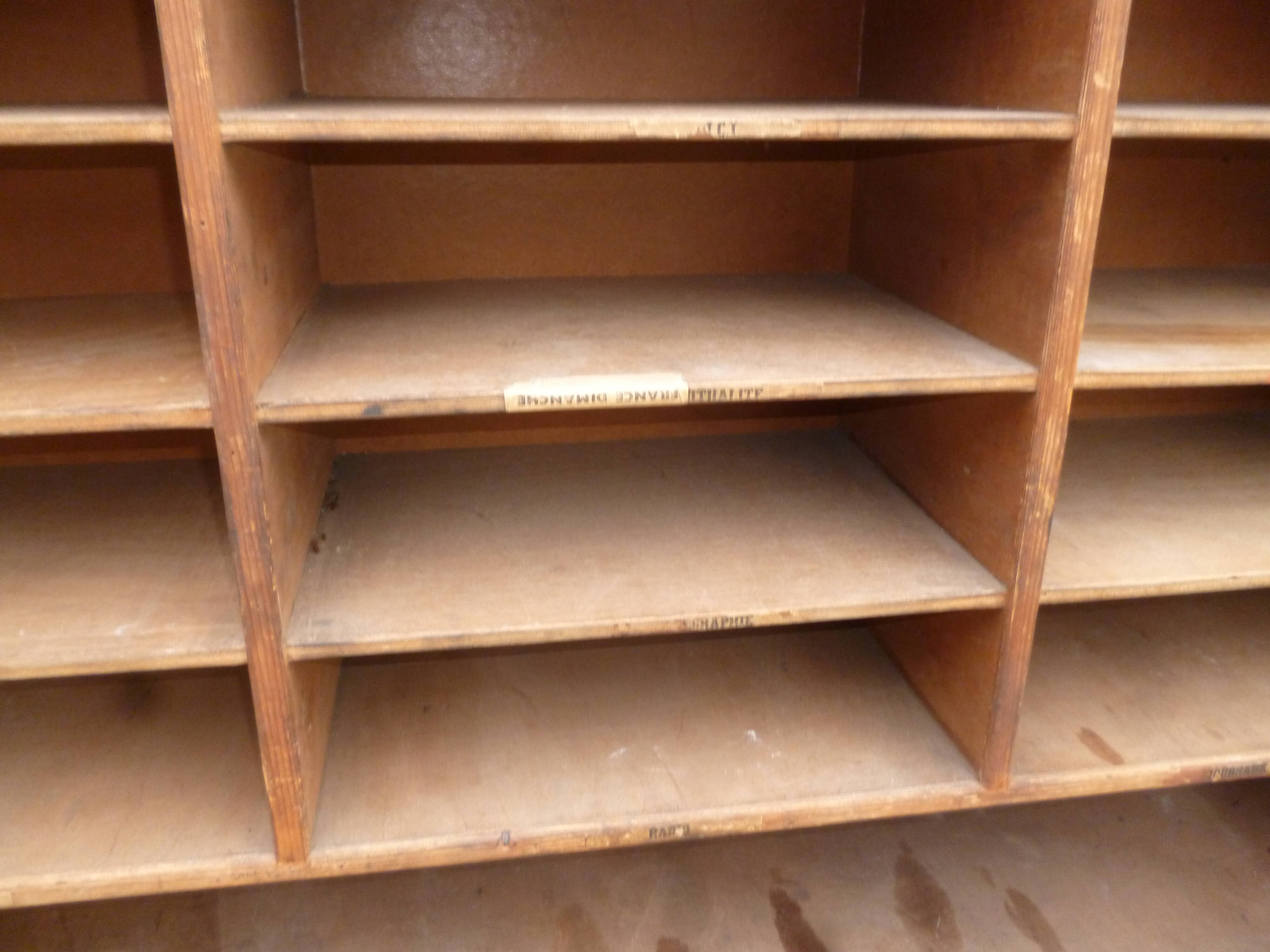 Sorting wood locker cabinet with Vintage labels