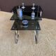 Set of 3 nesting tables in metal and smoked glass.