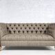 Chesterfield sofa in leather, fabric and wood