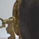 Adjustable psyche mirror of 33 centimeters in gilded bronze with angel ornament