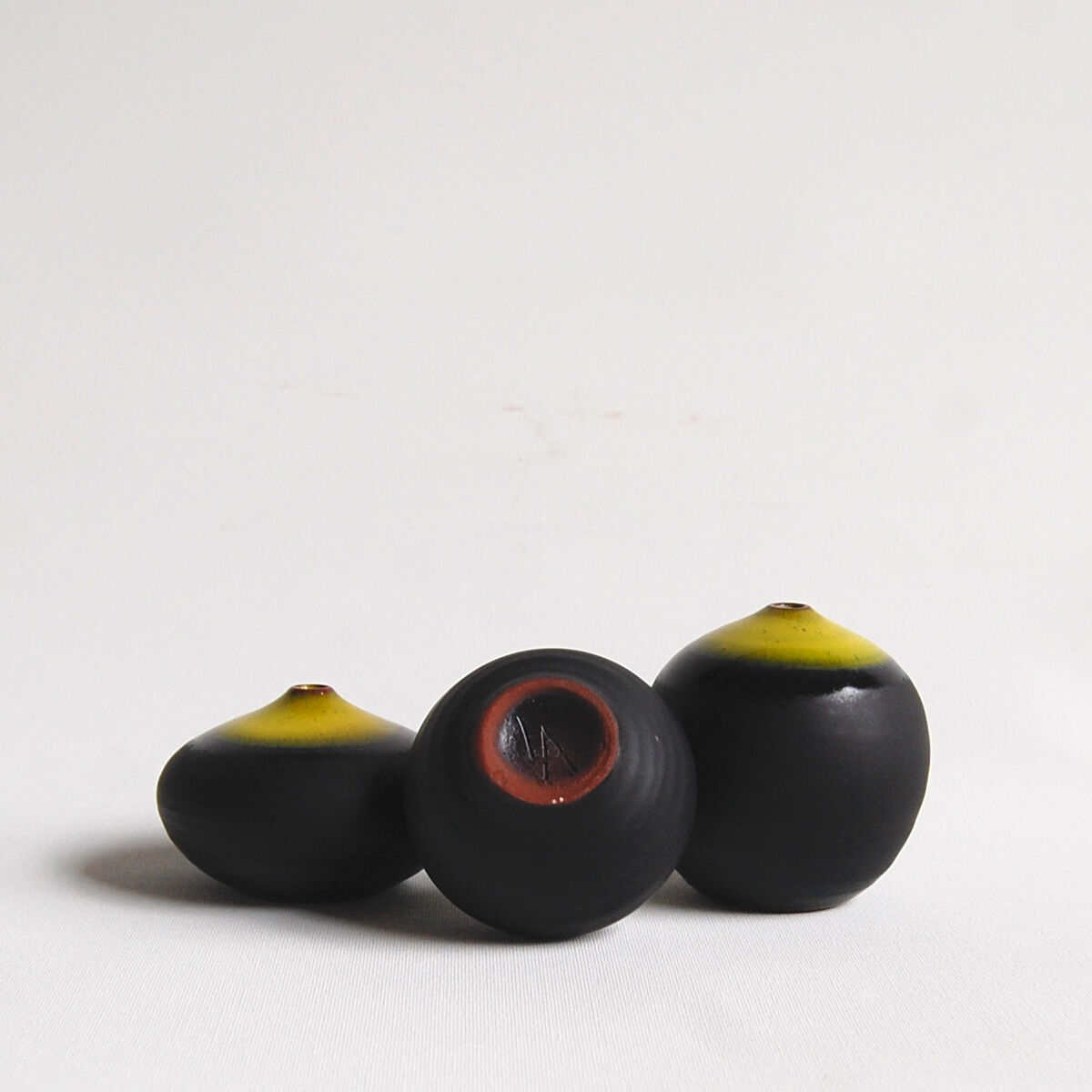 Trio of black and yellow miniature ceramics Antonio Lampecco