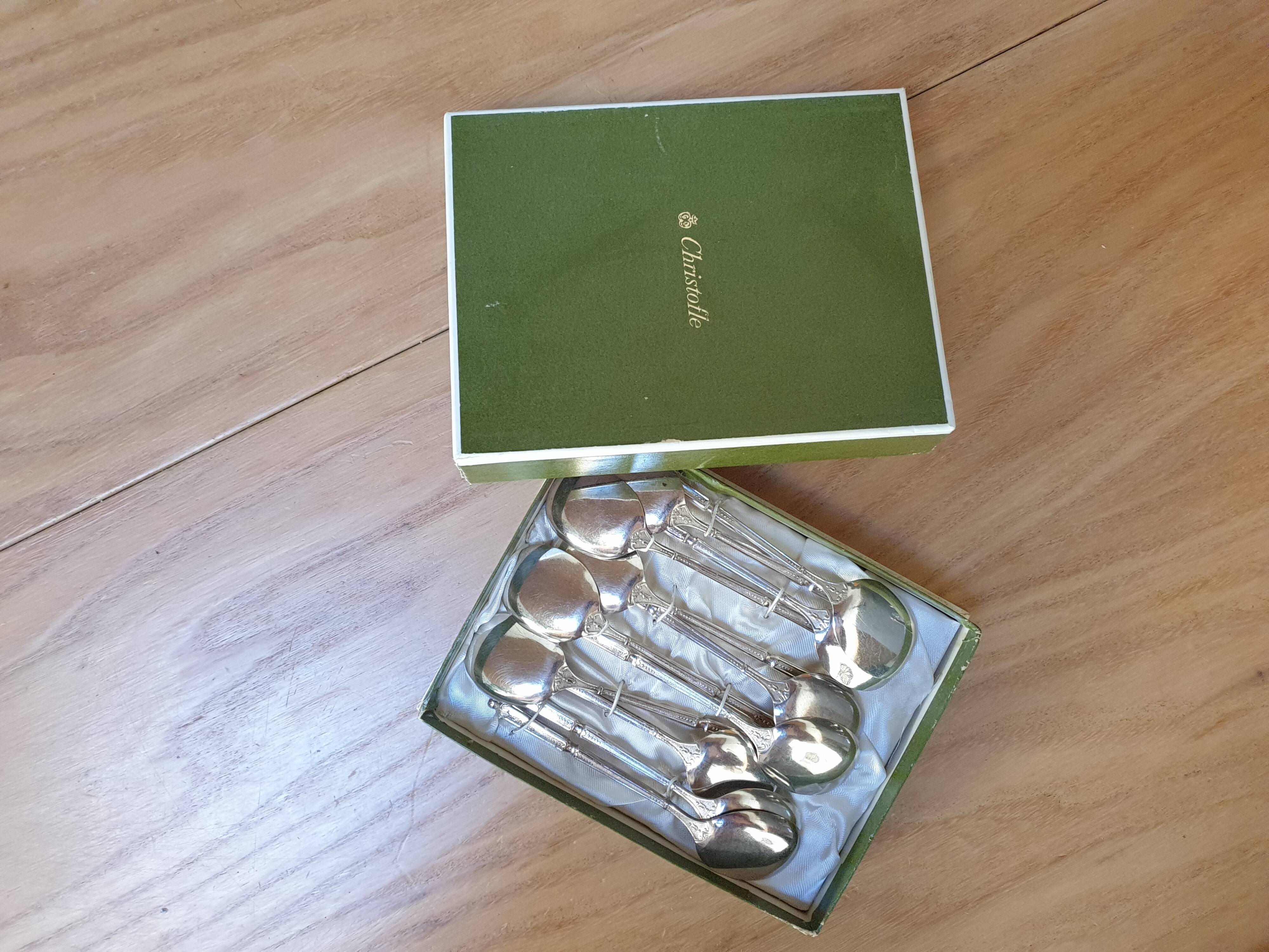 Punched silver metal ice spoons