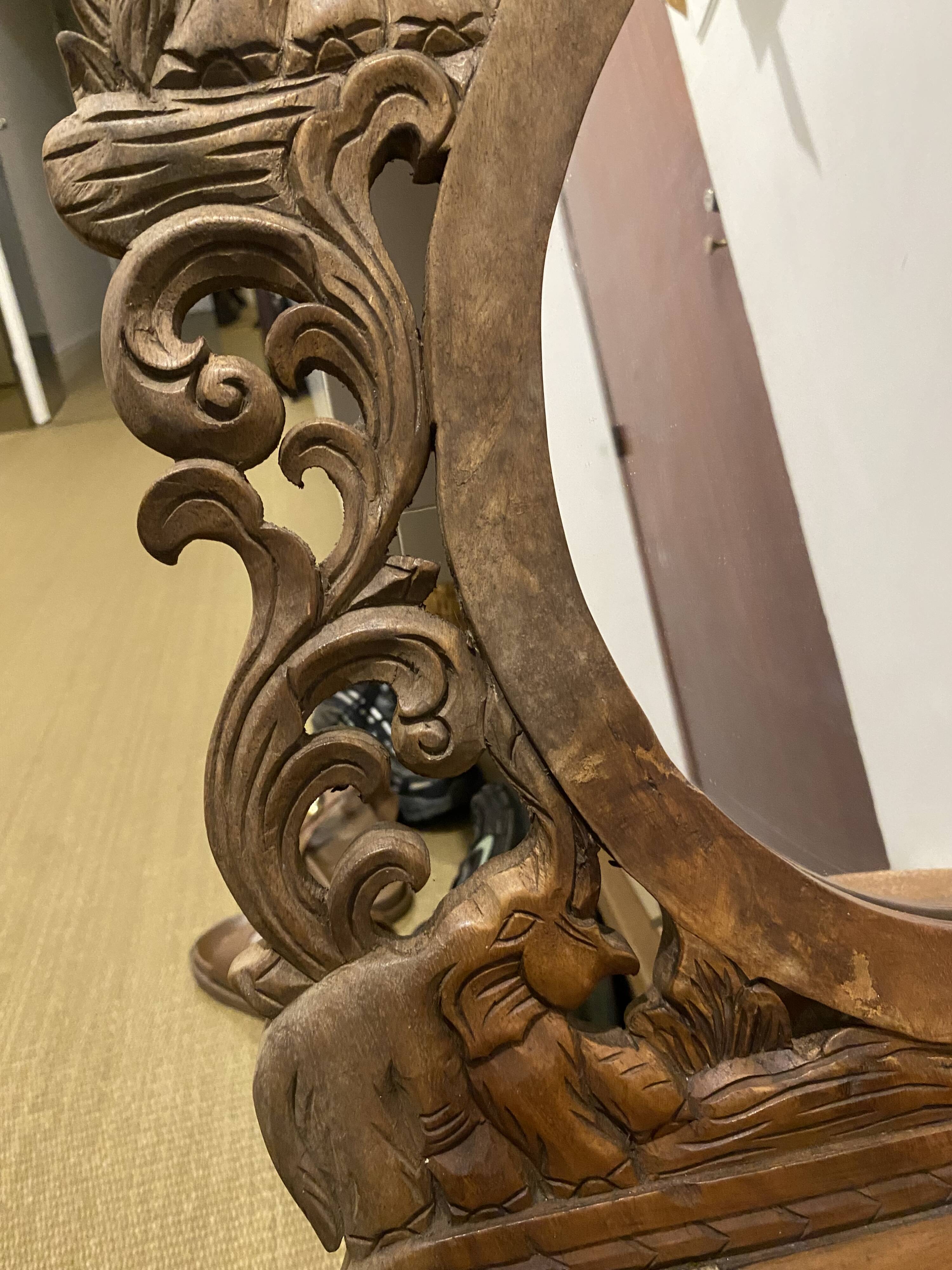 Carved mirror with integrated shelf
