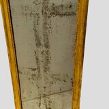 Louis XVI mirror in carved and gilded wood with leaf 18th century