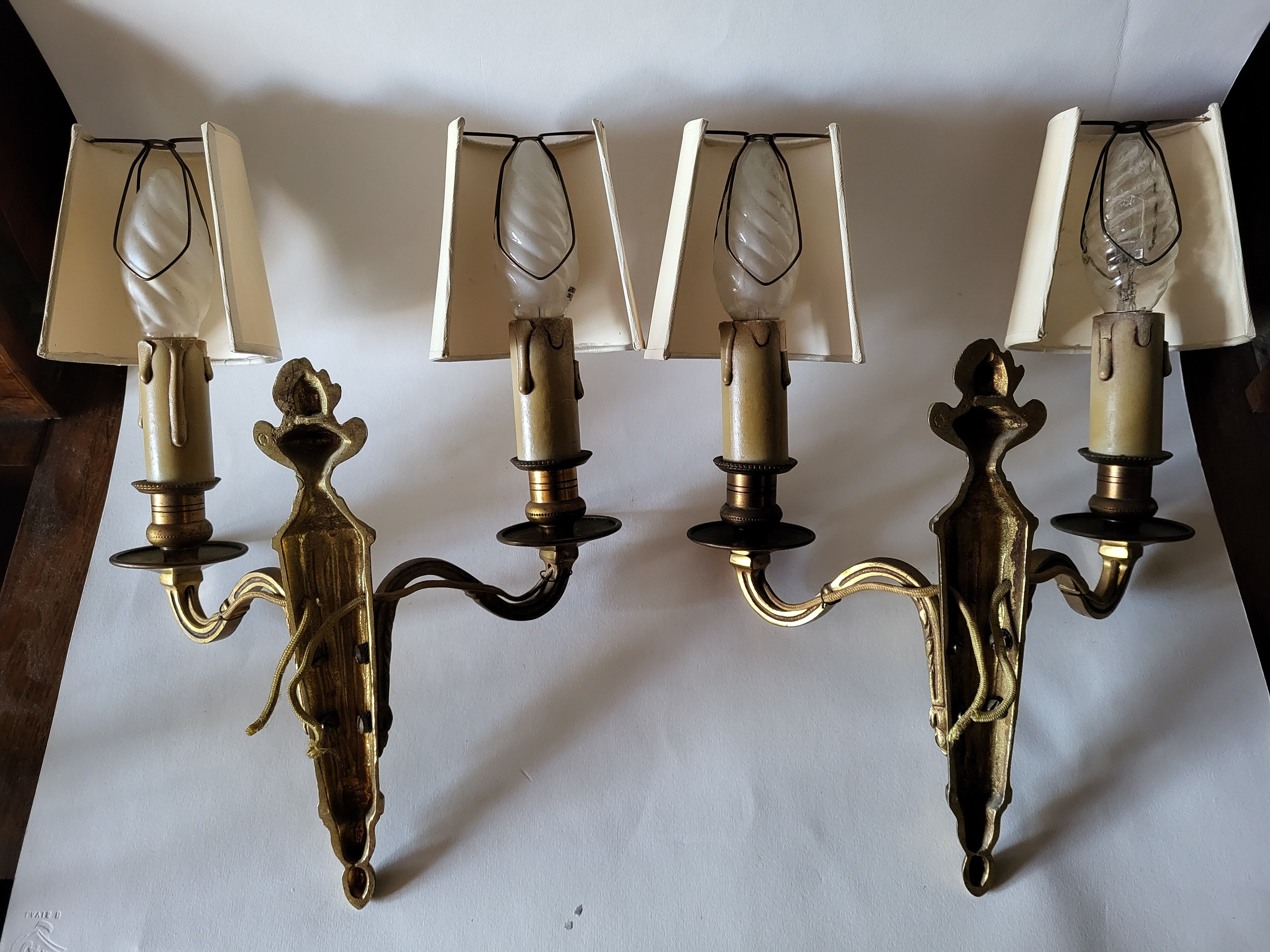 Pair of antique gilded iron wall lamps