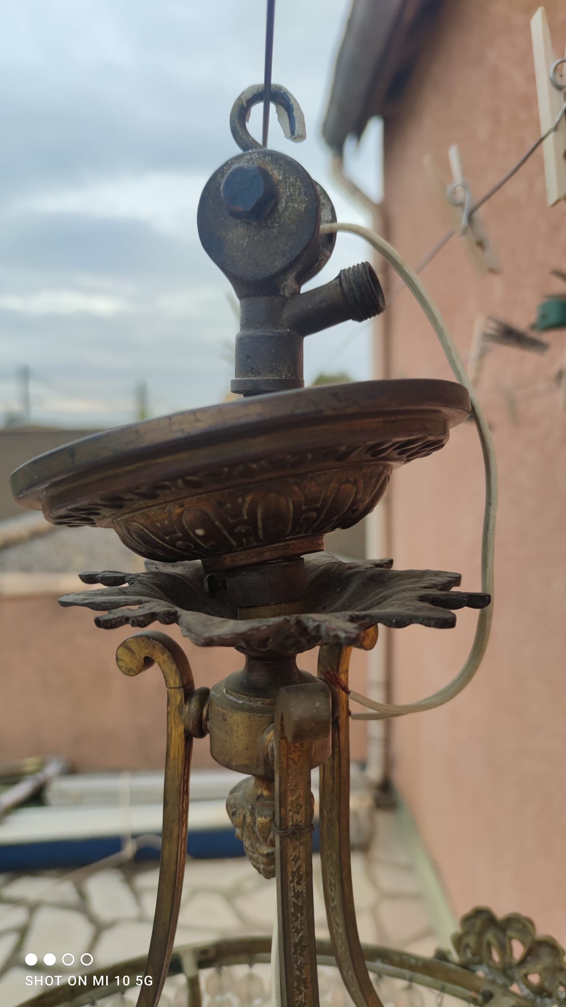 Antique bronze and crystal chandelier, formerly gas-powered, dating from the late 19th century.