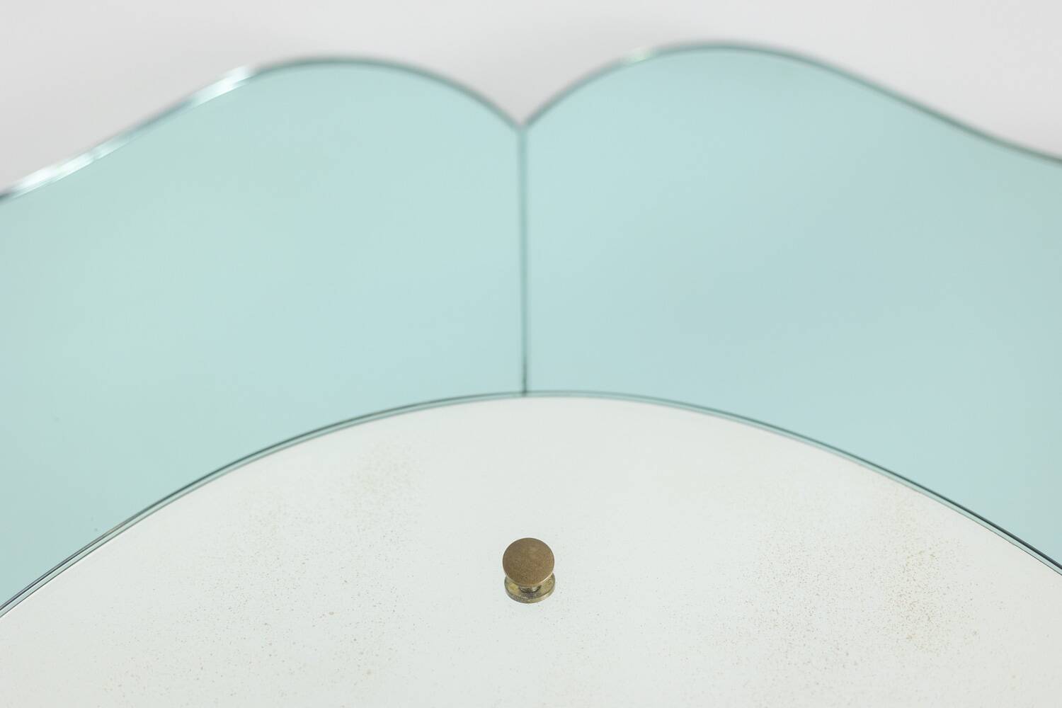 Two-tone glass console mirror with gilded brass. Circa 1950.