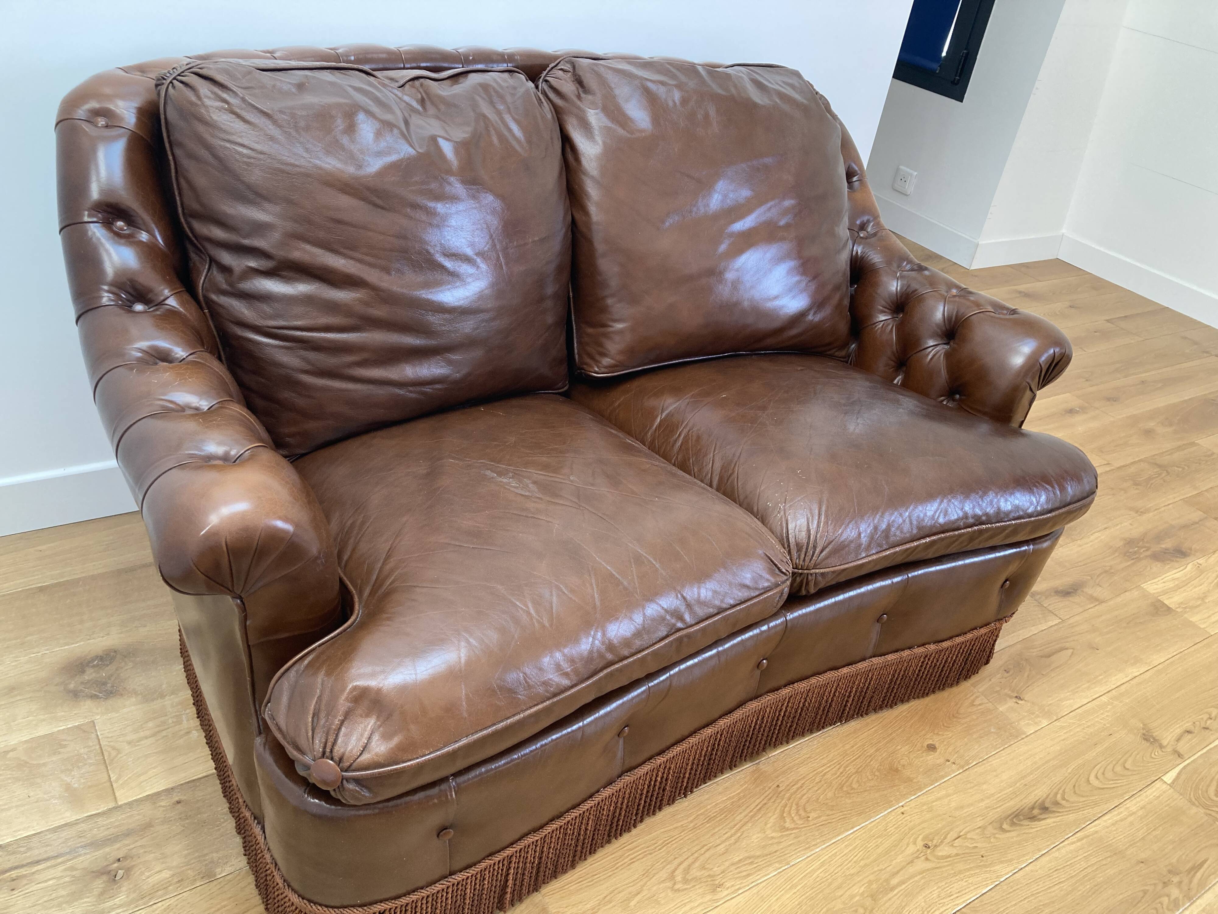 Chesterfield leather sofa with fringes