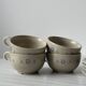 Ceramic cups and saucers with flower decoration