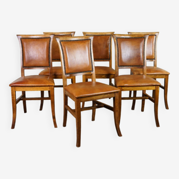 Set of six sheep leather dining chairs with a light wooden frame