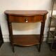 Cherry half-moon console with drawer and bottom shelf