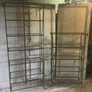 Pair of wrought iron and glass bookshelf shelves.