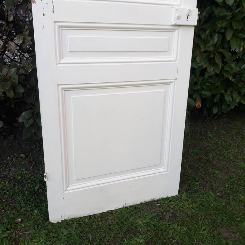Communication door H220xW80.5cm, old panelled with moulding.