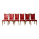 Set of 6 vintage wooden chairs with red faux leather in retro style.