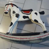 Old rocking horse in painted wood