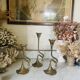 Art Nouveau style brass candlestick trio