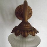 French Art Nouveau wall sconce in bronze with a white and pink glass shade.