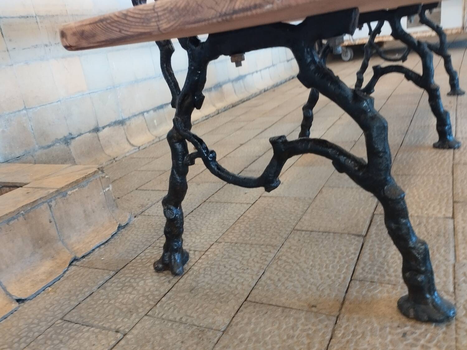 Antique garden bench with cast iron legs
