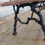 Antique garden bench with cast iron legs