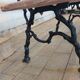 Antique garden bench with cast iron legs